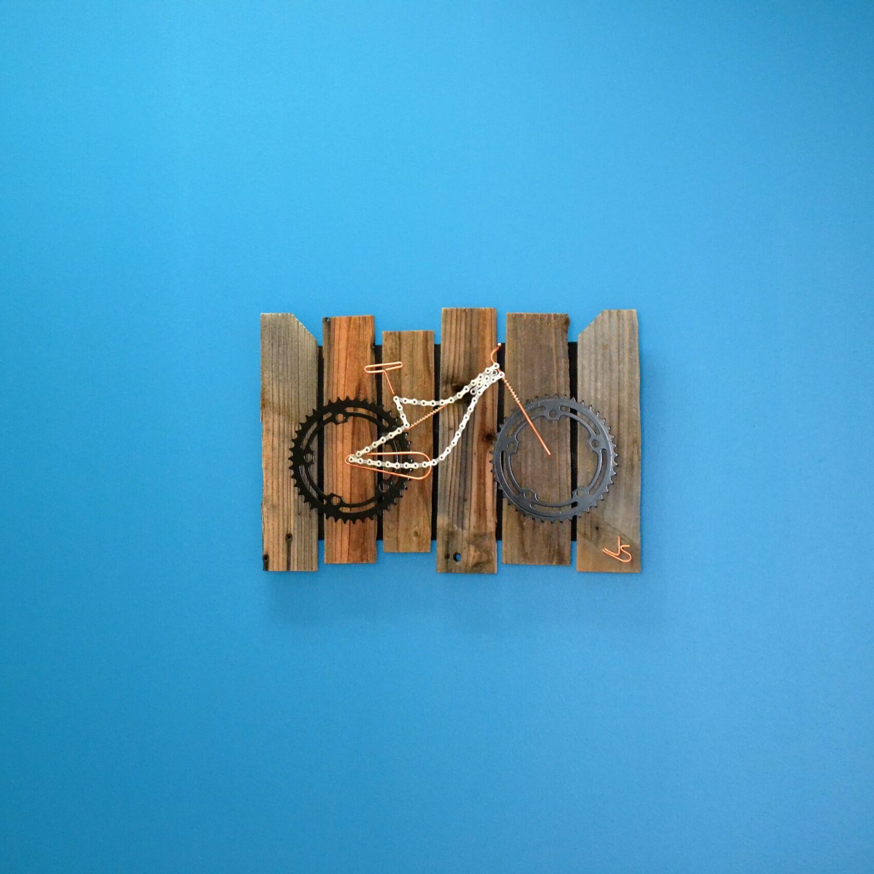 Decorative artwork of a bicycle found in the Sports & Performance Physical Therapy facility.
