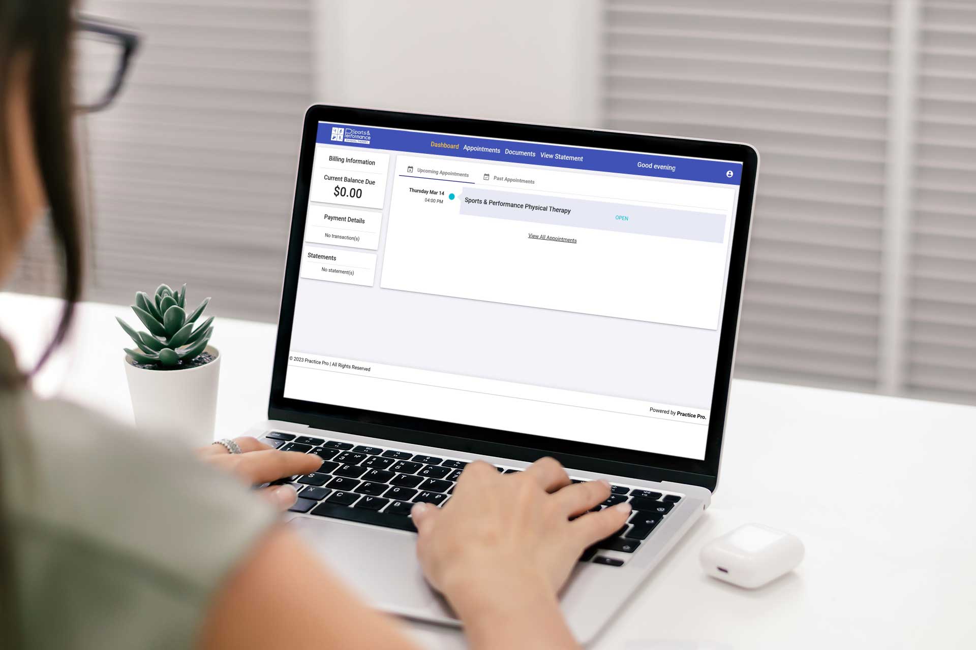 A mockup of a person accessing their Sports & performance Patient Portal on their Macbook laptop.