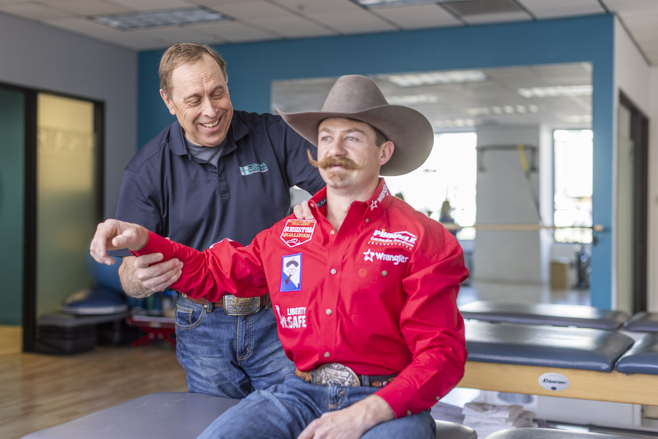 Physical therapist working with 3x NFR Bareback Rider, Wyatt Denny.